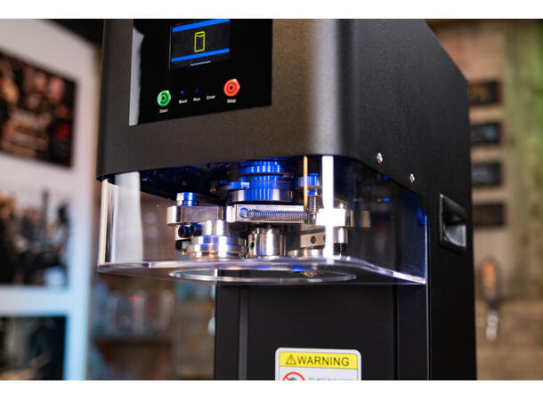 Automatisk burkmaskin